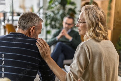 adult couple at family therapy with psychologist. photo