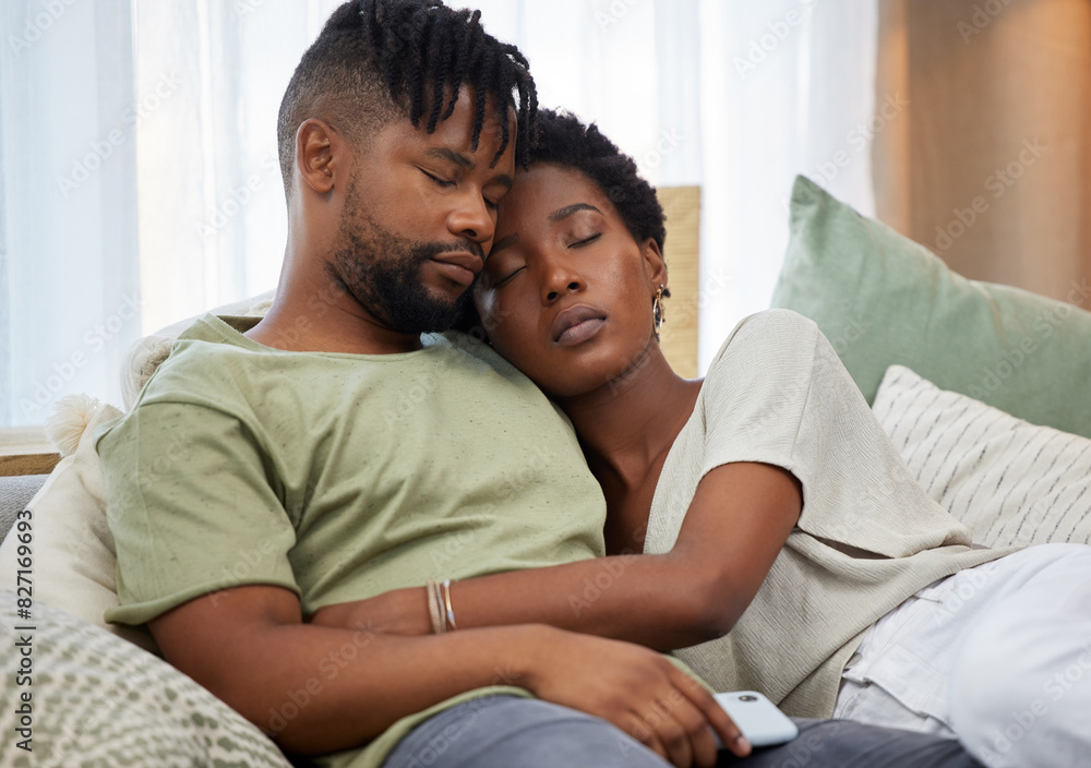 African couple and sleeping together with hug on sofa for rest, relax and bonding in living room. Relationship, man and woman in marriage with love embrace on couch for comfort, peace and support African couple and sleeping together with hug on sofa for rest, relax and bonding in living room. Relationship, man and woman in marriage with love embrace on couch for comfort, peace and support