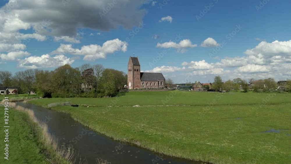 Dutch Tranquility: Aerial Perspective of Wanswert Church with Cloudy Sky Dutch Tranquility: Aerial Perspective of Wanswert Church with Cloudy Sky