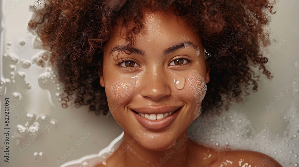 Cheerful woman with curly hair, using moisturizing cream, isolated on a white background Cheerful woman with curly hair, using moisturizing cream, isolated on a white background