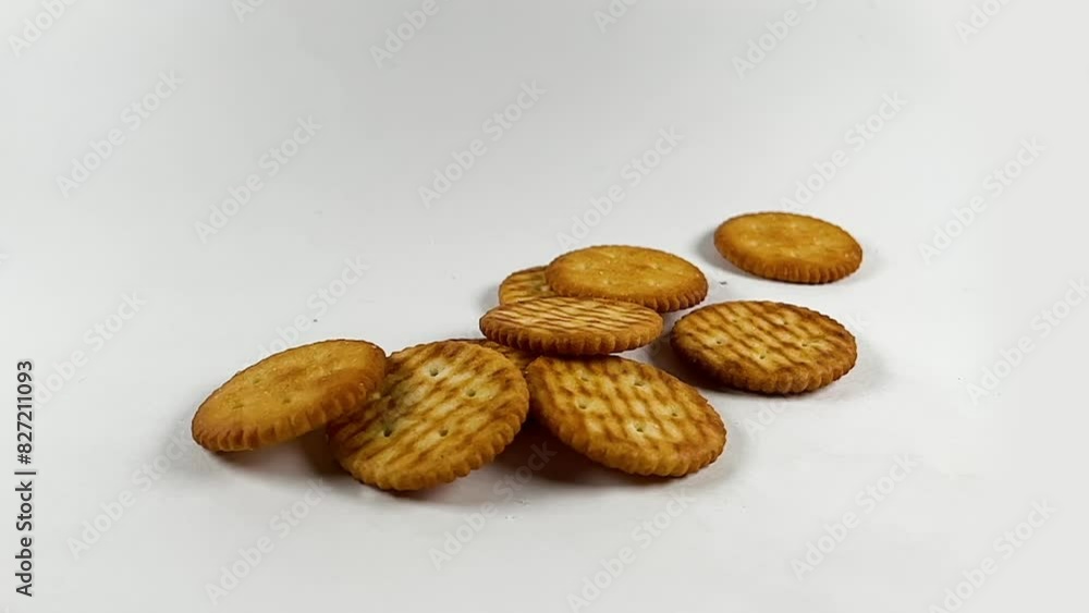 slow motion shot of falling salty crackers, salty biscuits in slow-motion slow motion shot of falling salty crackers, salty biscuits in slow-motion