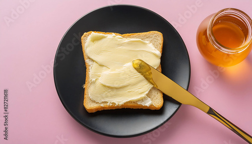 Butter on a slice of bread and honey. Bread with Thick Butter and Honey Jar: A Delightful Breakfast. Bal kaymak