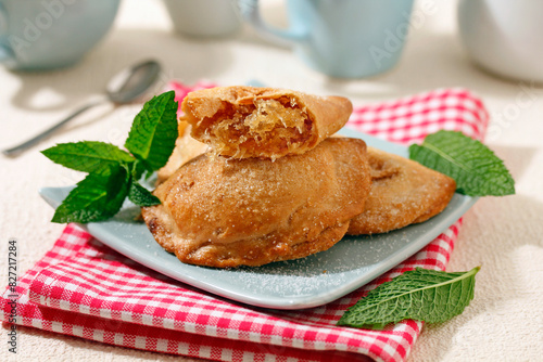 Sweet pastries stuffed with pumpkin and syrup. photo