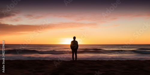 silhouette of man standing at beach against sky during sunset,portugal