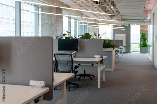 Interior of modern empty office building.Open ceiling design.Equipped with automatic lifting table and LCD screen.
