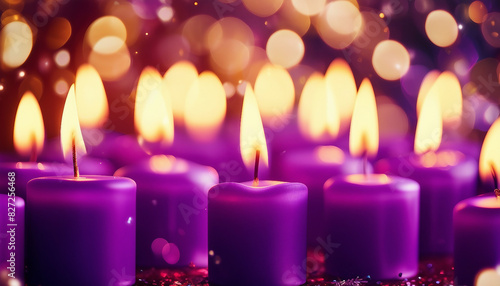 An assortment of purple candles lit up with a warm glow against a sparkling festive backdrop.