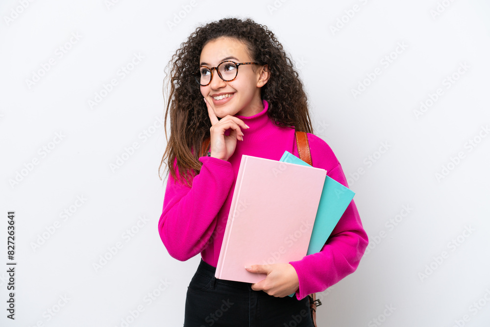 Young student Arab woman isolated on white background thinking an idea while looking up Young student Arab woman isolated on white background thinking an idea while looking up