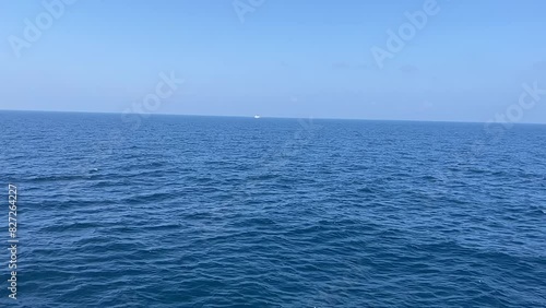 Slow motio video footage of relaxing view of blue ocean sea, soft waves and blue sky photo