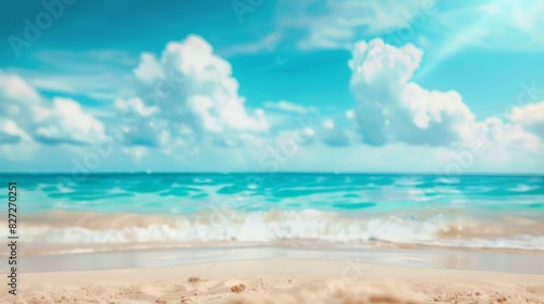 Blurred tropical beach. golden sand, turquoise ocean, blue sky, and white clouds on a sunny day