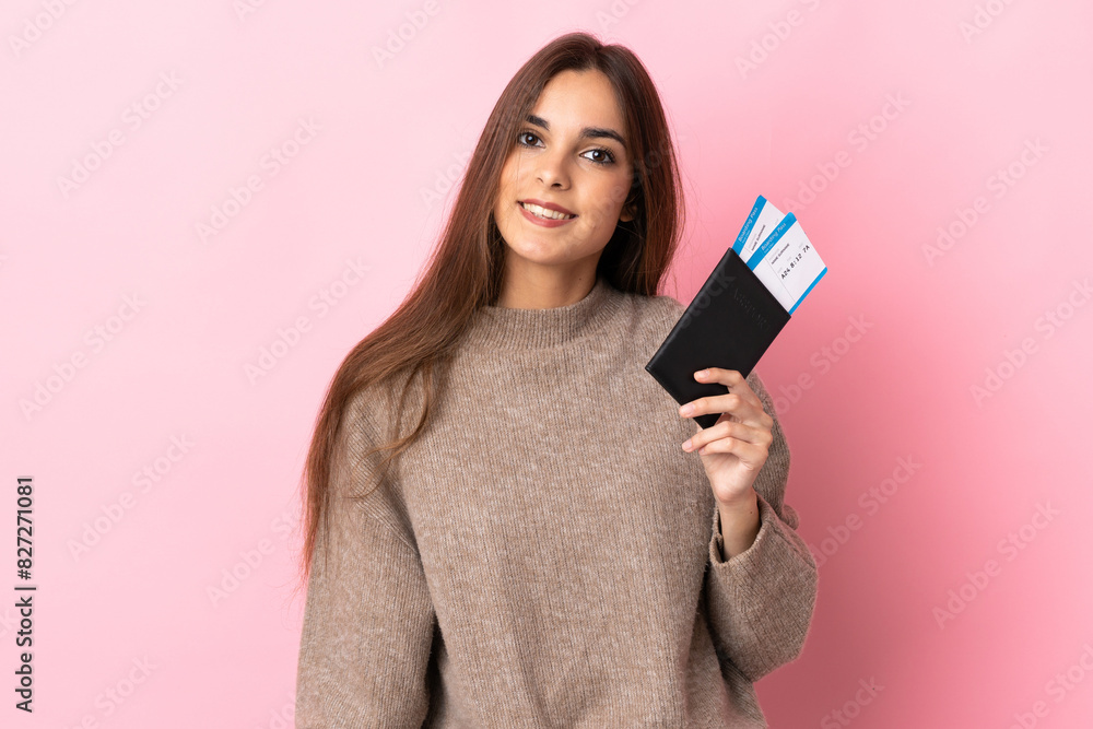 Young caucasian woman isolated on pink background happy in vacation with passport and plane tickets Young caucasian woman isolated on pink background happy in vacation with passport and plane tickets