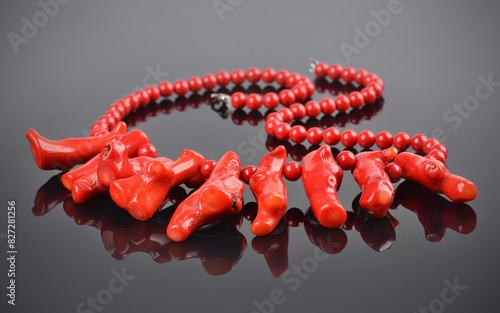 Detail of a beautiful red coral necklace on black background