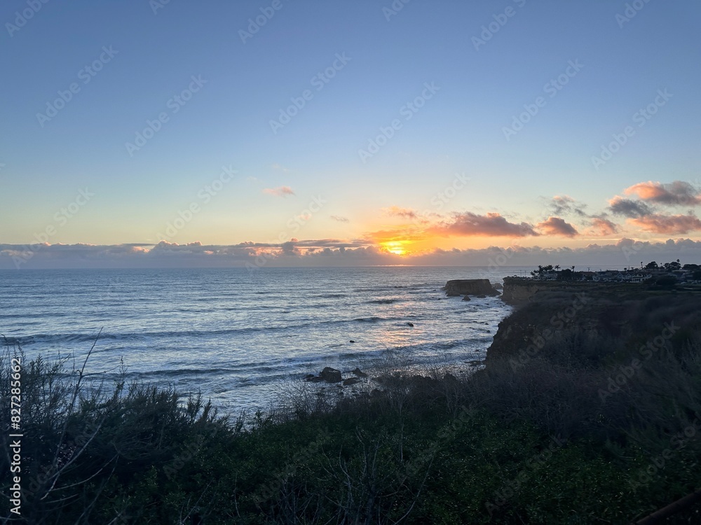 Scenic beach at dusk with a dramatic sky Scenic beach at dusk with a dramatic sky