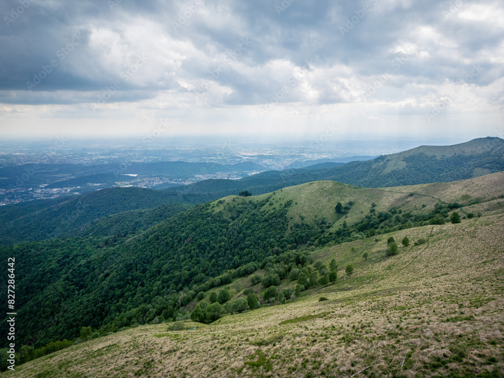 Bollettone Vista: Brianza Below - A Scenic View from Monte Bollettone Overlooking Brianza, Lakes, and Flatlands Bollettone Vista: Brianza Below - A Scenic View from Monte Bollettone Overlooking Brianza, Lakes, and Flatlands