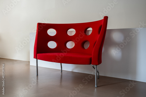 red sofa with modern design in room with white walls