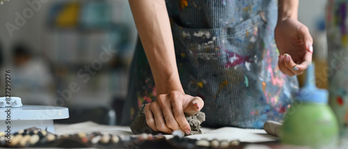 Banner cover with Young Artist's hands pressing and kneading clay in a workshop, Panorama image