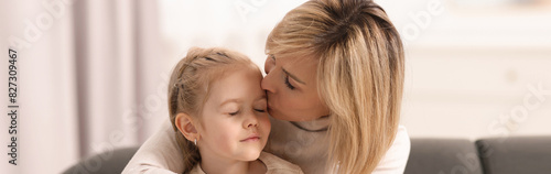 Mother and her little daughter spending time together at home, banner design