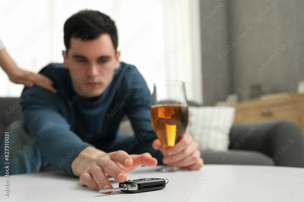 Woman stopping man from drunk driving, closeup. Don't drink and drive concept Woman stopping man from drunk driving, closeup. Don't drink and drive concept