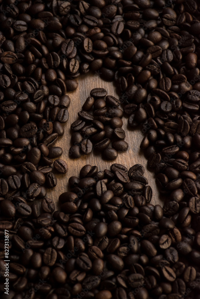 Close-up of coffee beans arranged to form the letter Close-up of coffee beans arranged to form the letter