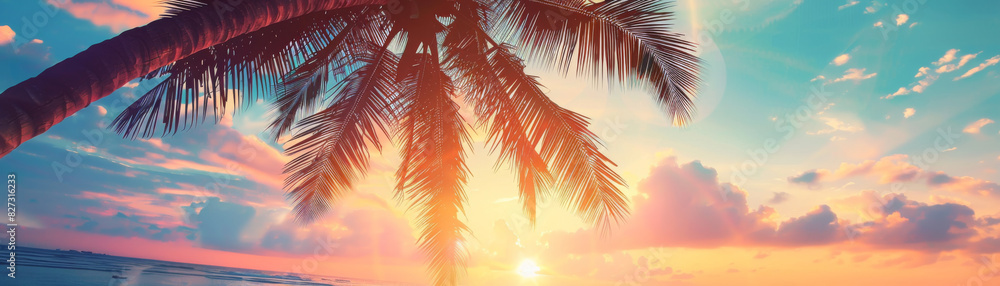 Fototapeta premium Summer beach sunset close up, focus on, copy space Warm hues, vibrant sky Double exposure silhouette with palm trees