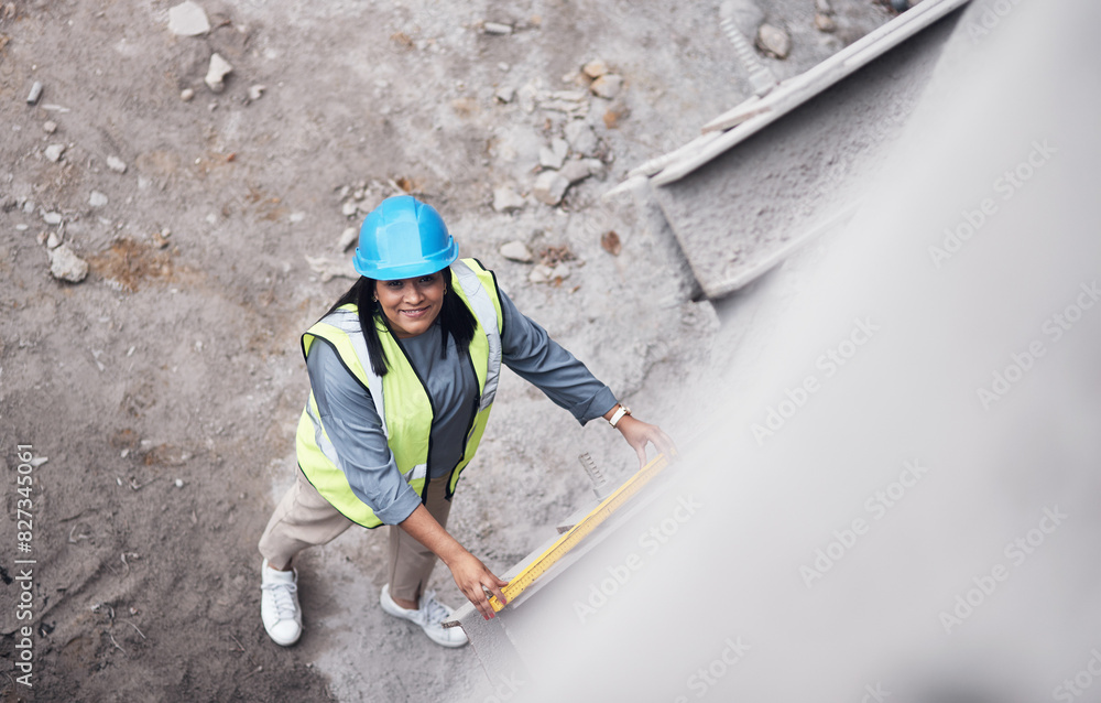 Woman, smile or portrait with level at construction site for property, architecture or above at building. Engineer, technician and happy with helmet for inspection, measure or real estate development Woman, smile or portrait with level at construction site for property, architecture or above at building. Engineer, technician and happy with helmet for inspection, measure or real estate development