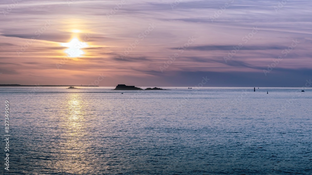 Sunset sky reflecting over the water in Saint-Malo, Brittany, France Sunset sky reflecting over the water in Saint-Malo, Brittany, France