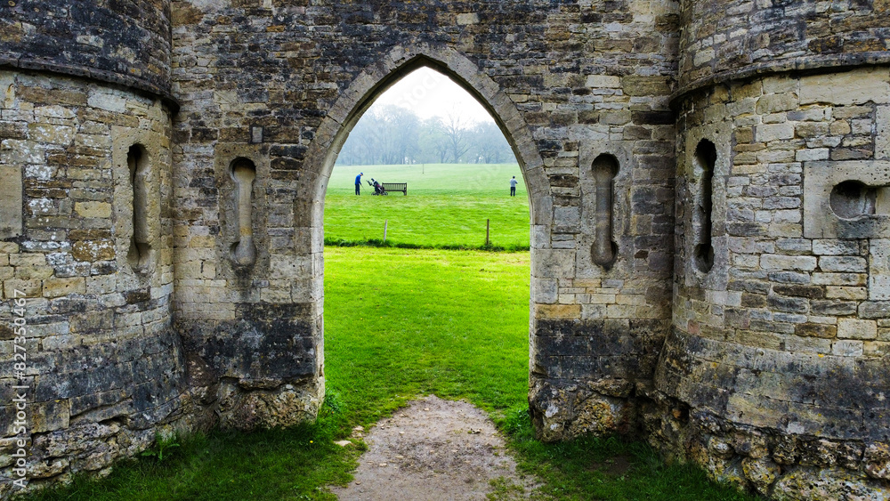 Castle doorway looking through at some golfers. Castle doorway looking through at some golfers.