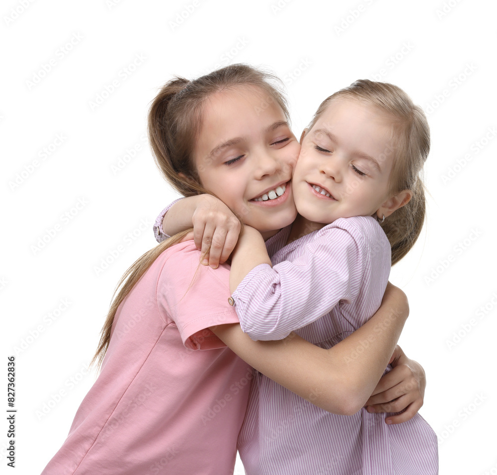 Portrait of cute little sisters on white background Portrait of cute little sisters on white background