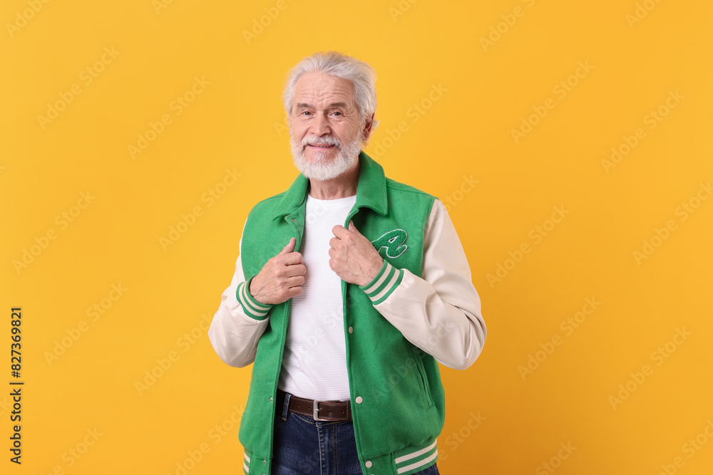 Portrait of stylish grandpa on yellow background Portrait of stylish grandpa on yellow background