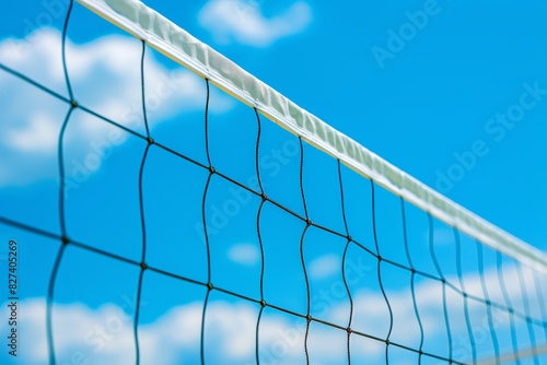 Vibrant beach volleyball net against blue sky  summer olympic games sport concept © Ilja