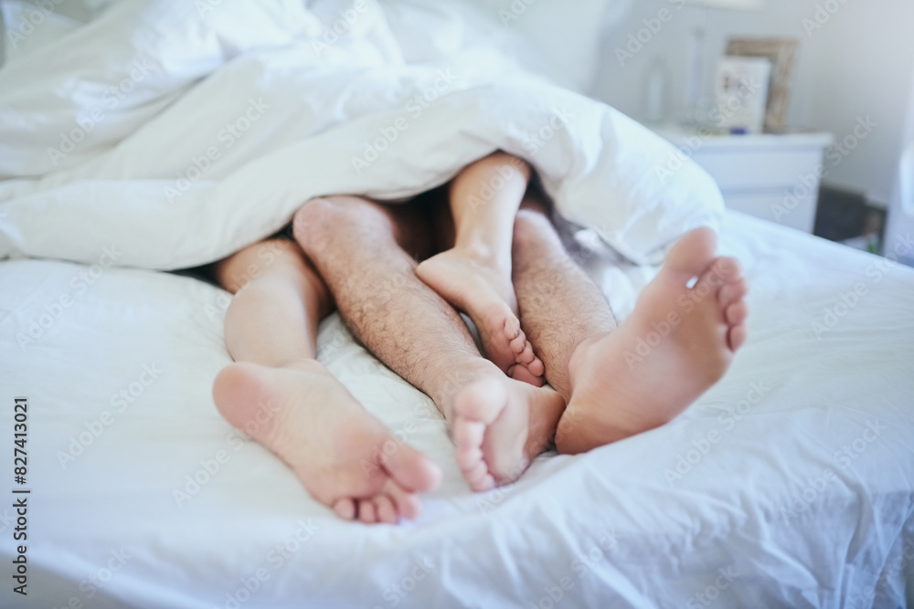 Couple, feet and bed in a home with sleeping, morning and love together in a bedroom. Romance, passion and care of people legs under a duvet and blanket with marriage, cuddle and nap in a house Couple, feet and bed in a home with sleeping, morning and love together in a bedroom. Romance, passion and care of people legs under a duvet and blanket with marriage, cuddle and nap in a house