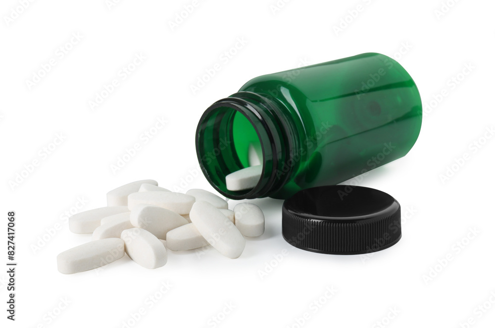 Scattered vitamin pills and bottle isolated on white Scattered vitamin pills and bottle isolated on white