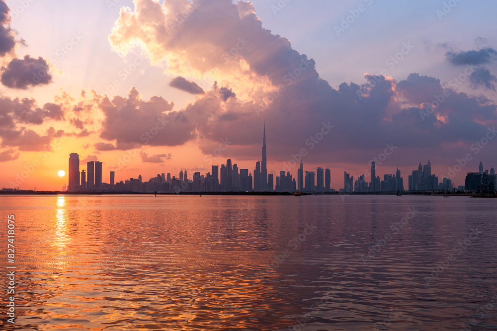 Naklejka premium amazing sunset view of Dubai Downtown cityline from Dubai Creek harbour