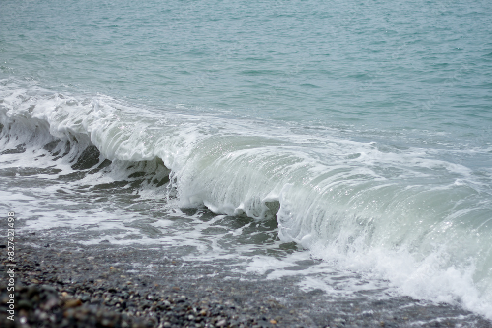 Sea wave crashing on the shore