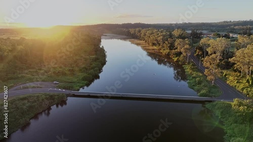4K, drone aerial, dawn sunrise over Burnett river, Cedars road bridge South Kolan, Queensland, off road rural countryside scenery, camping adventure 4WD family holiday vacation photo