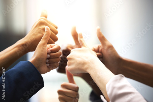 Business people, hands and thumbs up for support, success and team work in office collaboration. Worker, group or circle in like, yes and okay gesture for good job, winning and well done with goals photo