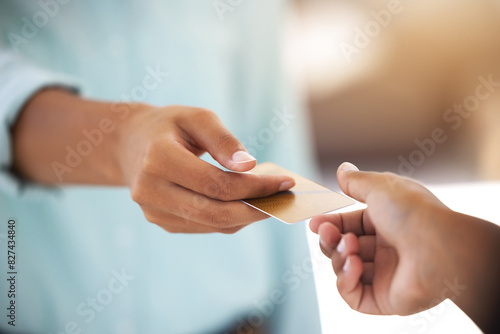 People, hands and giving credit card for payment, transaction and shopping at retail shop in city. B2c, customer or client with financial exchange for services with offer at point of sale or banking
