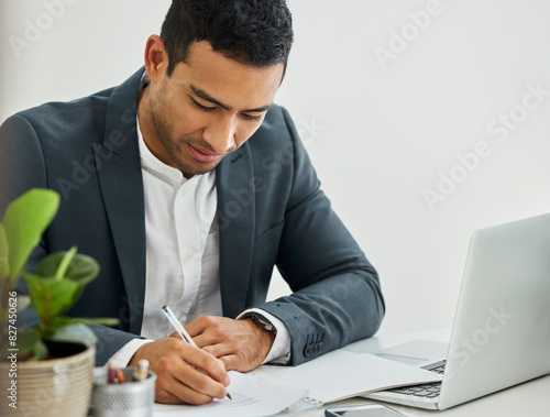 Man, technology and writing on document in office with contract, legal advisor or attorney at work. Male lawyer, laptop and pen with paper at desk for justice, estate tax or compliance at law firm photo