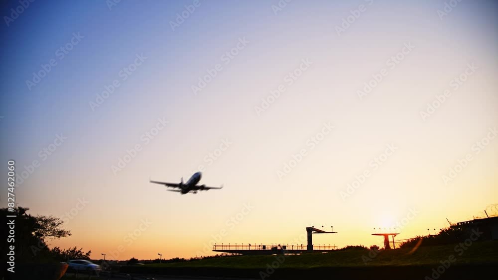 The airplane is landing in the evening The airplane is landing in the evening
