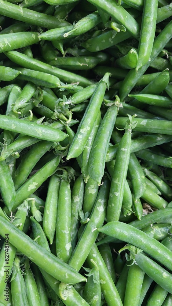 Close-up photo of green pea pods at the market, healthy food, macro photography