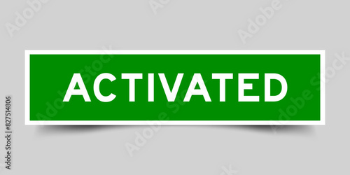 Sticker label with word activated in green color on gray background