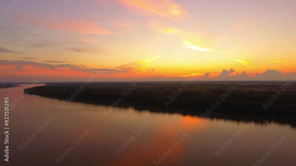 Aerial Panning Scenic Shot Of Rippled River Stream Under Orange Cloudy Sky At Sunset - Bayou Vista, Texas Aerial Panning Scenic Shot Of Rippled River Stream Under Orange Cloudy Sky At Sunset - Bayou Vista, Texas