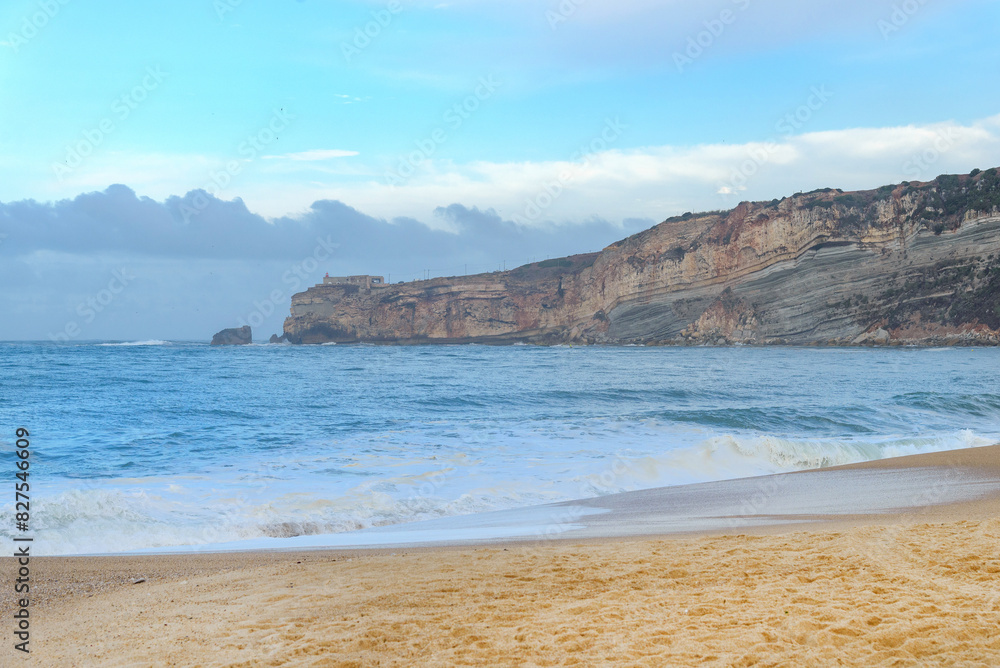 Aerial view of sandy beach and Atlantic ocean with big waves in Nazare, Portugal. Surfing paradise town in Portugal, Europe Aerial view of sandy beach and Atlantic ocean with big waves in Nazare, Portugal. Surfing paradise town in Portugal, Europe