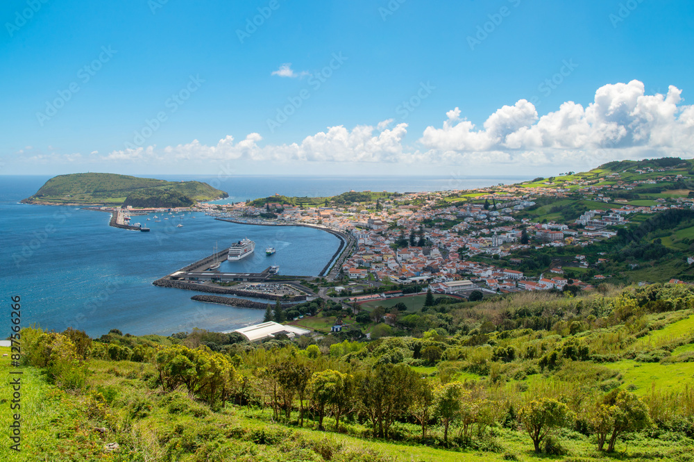 Obraz premium The City of Horta and Horta Bay of the Azores, Portugal. Aerial view of Portuguese town Horta on an the Atlantic ocean coast, on a sunny day, Faial island.