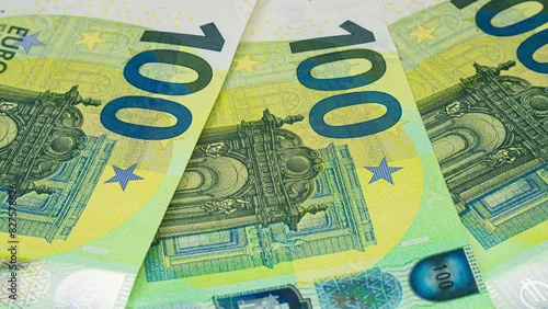 Several new100 euro bills, close up Cash money banknotes. . Finance and investment concept. Closeup shot. Currency exchange of one hundred euro. Rich business economy photo