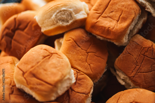 Closeup of a pile of brown hamburger buns at a picnic photo