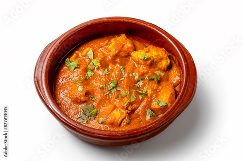 a plate of chicken curry isolated on white table from above