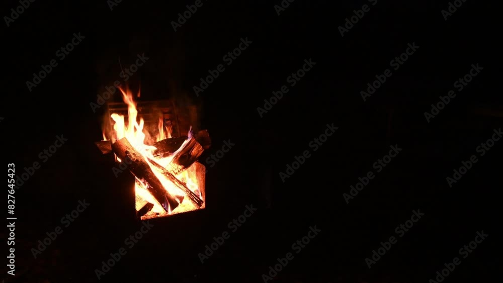 A nighttime view of a crackling campfire with sparks flying into the air. The fire is on the left side of the clip with lots of room for copy on the right.
A nighttime view of a crackling campfire with sparks flying into the air. The fire is on the left side of the clip with lots of room for copy on the right.