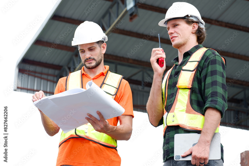 Engineer wearing safety helmet working at the construction site, precast wall factory. Engineer wearing safety helmet working at the construction site, precast wall factory.