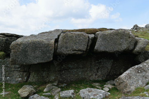 Granite boulders on grassy hillside