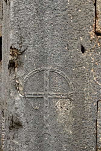 A cross carved on a ston of the Byzantine Basilica in the Kayabasi in the northeast section of the 
Akoren Ancient City in Aladag district of Adana province in Southern Turkey. 
 photo